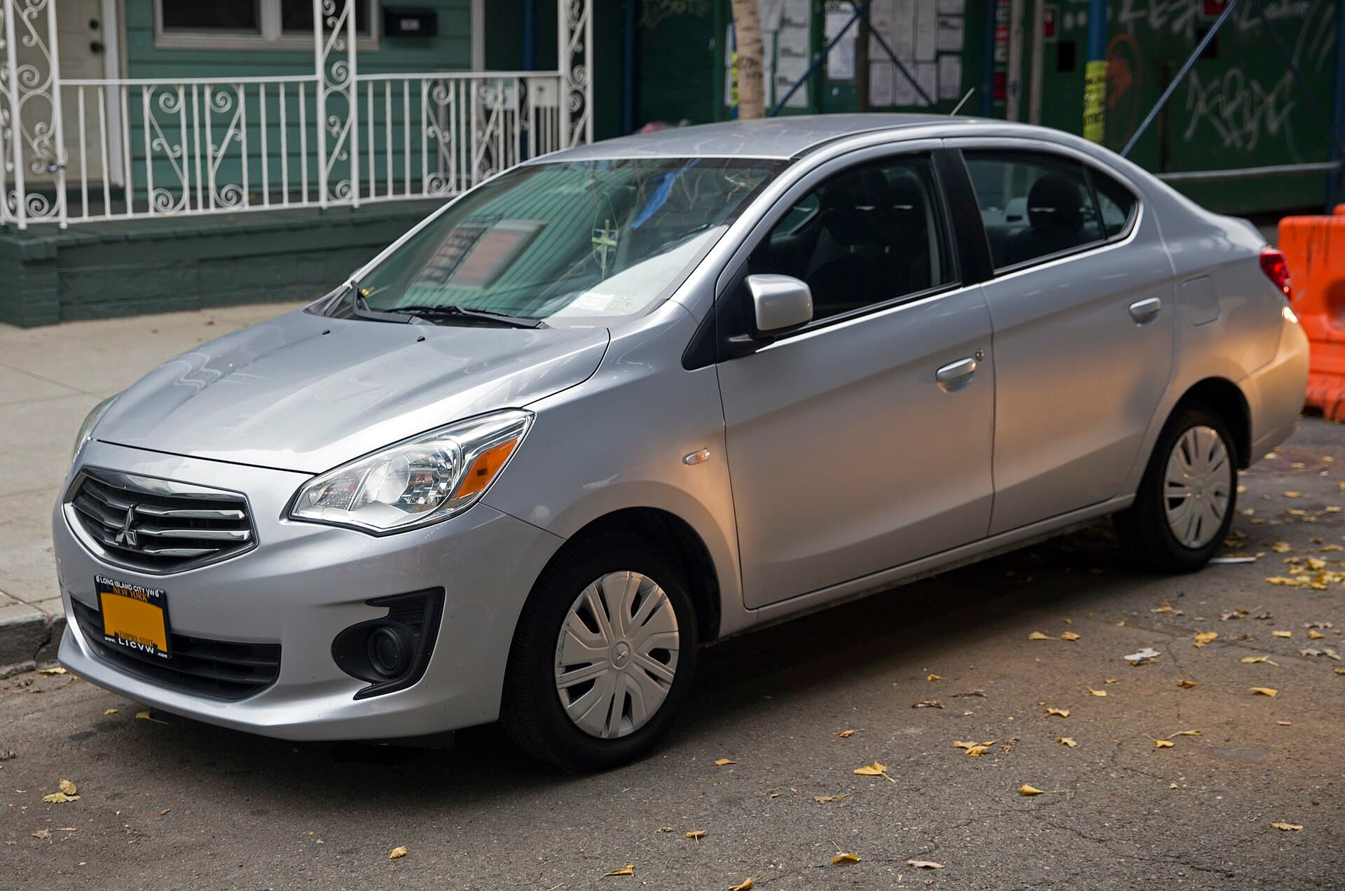 Silver Mitsubishi Mirage G4 sedan parked on a city street